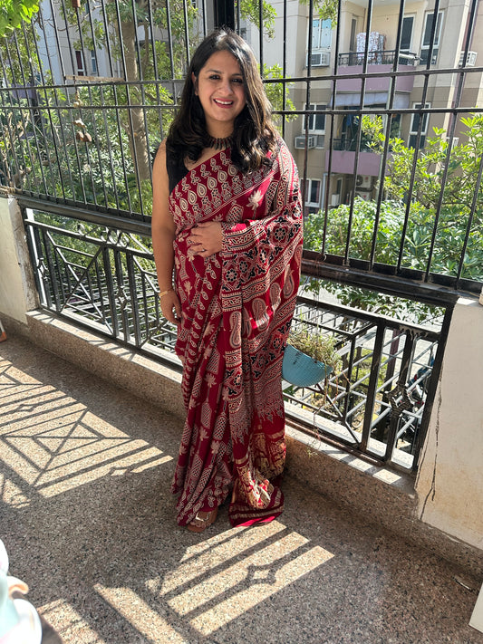 MAROON AJRAKH PRINT MODAL SILK SARI WITH ZARI BORDER