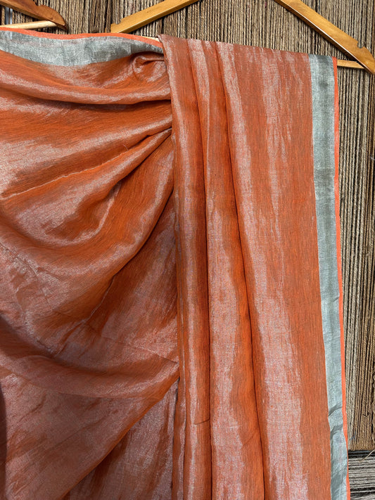Rust orange metallic linen sari with woven border and tassels
