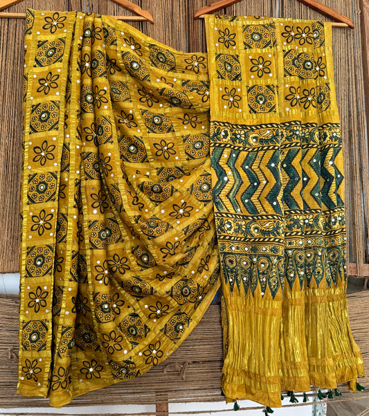 GOLDENROD YELLOW AJRAKH HANDCRAFTED MIRROR WORK (PASTING)GHARCHOLA MODAL SILK SARI WITH ZARI PALLU