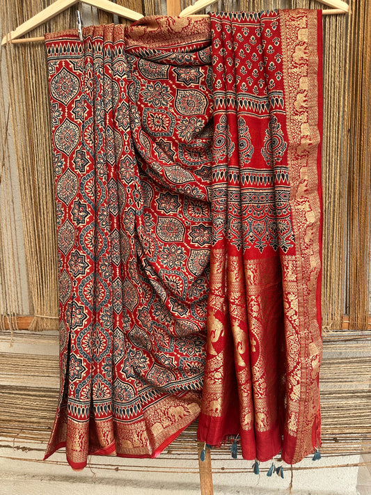 RED DOLA SILK AJRAKH ZARI BORDER SARI