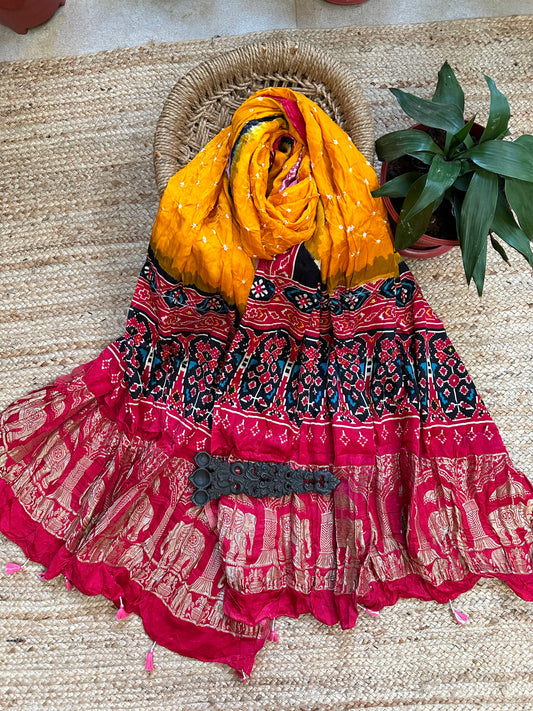 MUSTARD SILK BANDHANI DUPATTA WITH PATOLA PRINT IN NAKSHI BORDER