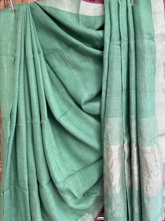 LIGHT GREEN COTTON SARI WITH WOVEN BORDER & PINK TASELS AND PALLA