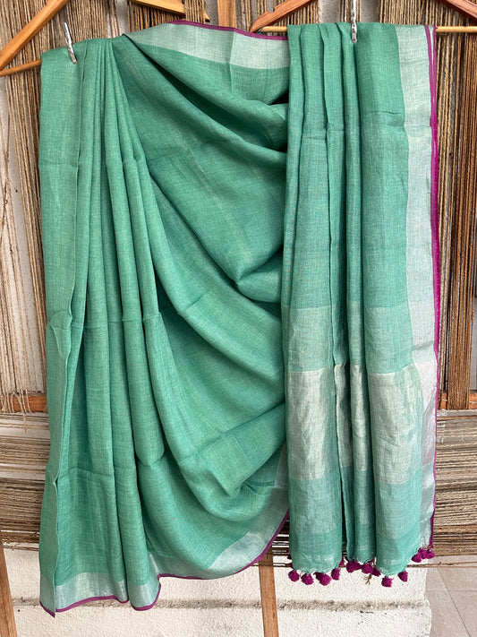 LIGHT GREEN COTTON SARI WITH WOVEN BORDER & PINK TASELS AND PALLA