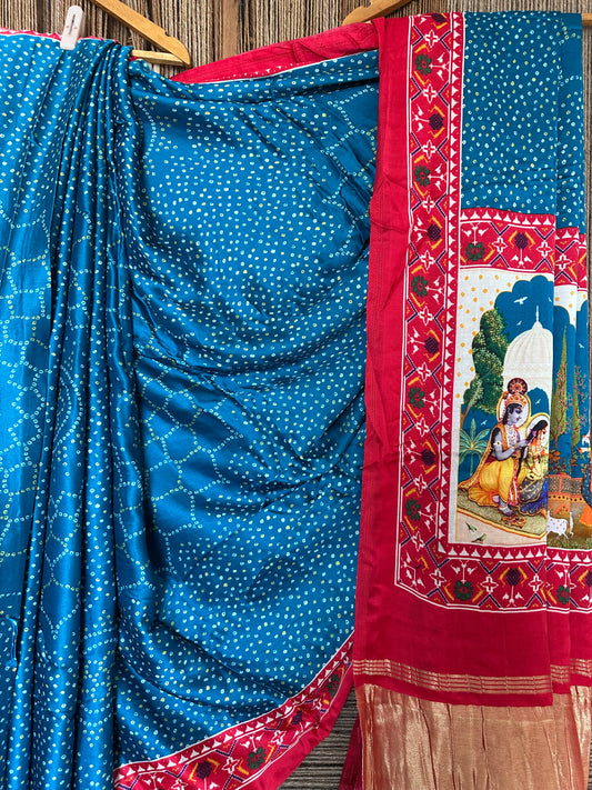 TURQUISE BLUE AND RED PICHWAI  MODAL SILK PATOLA PRINT SARI WITH ZARI BORDER