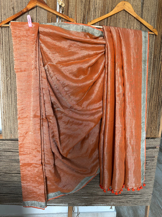 RUST ORANGE METALLIC LINEN SARI WITH WOVEN  BORDER AND TASSELS