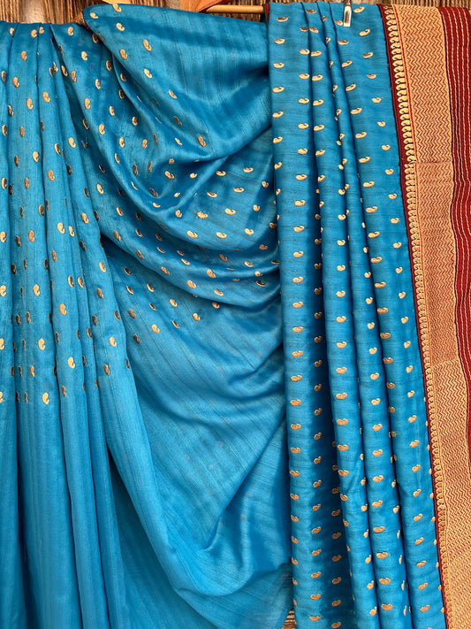 Beautiful Sky Blue with maroon border completely Embroidered Semi Raw Silk saree