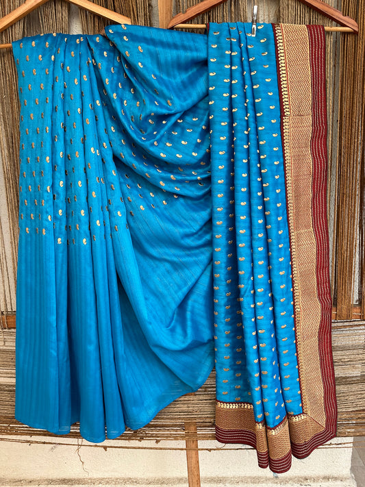 Beautiful Sky Blue with maroon border completely Embroidered Semi Raw Silk saree